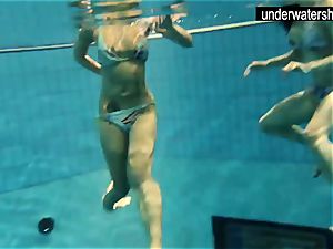 2 cool amateurs showing their figures off under water